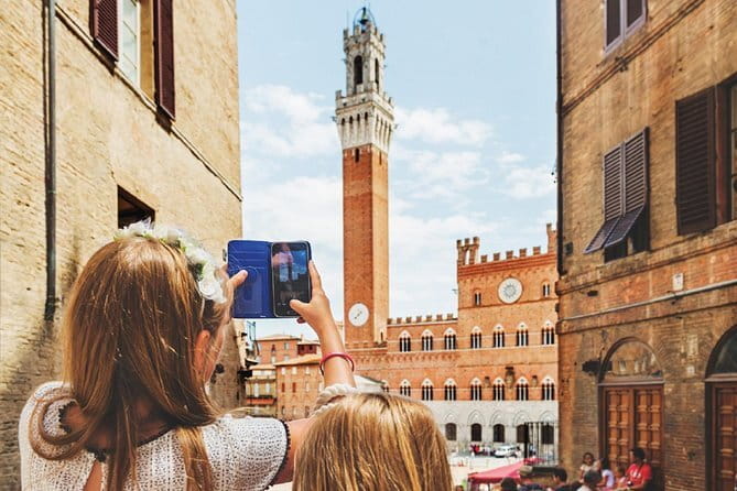 Tuscany Day Trip: Chianti & Cooking Class Small Group - San Gimignano: towers, shops, and a tight clock
